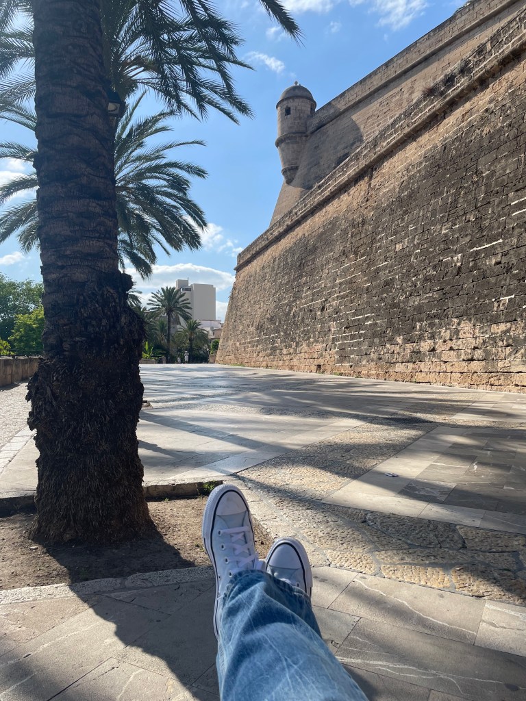 converse all star in front of Spanish fortress