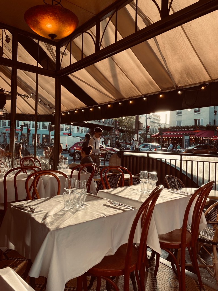 evening sun hitting on a typical Parisian bistro table